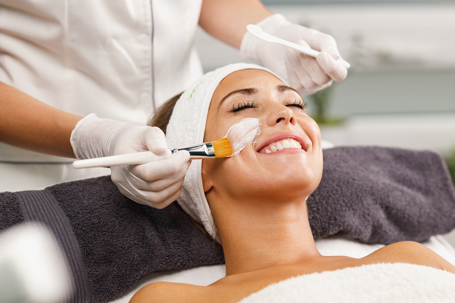 Shot of a beautiful young woman getting a facial mask treatment at the beauty salon.